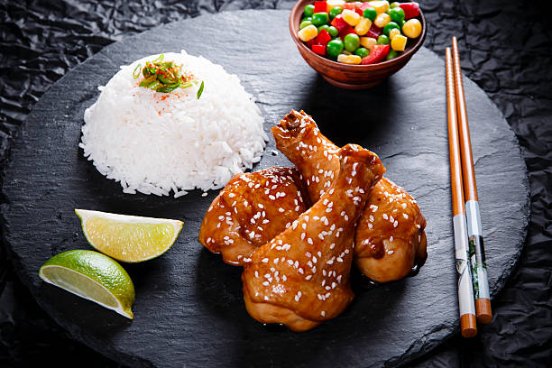 istock Fried chicken legs with teriyaki  sesame seeds  rice 595108716