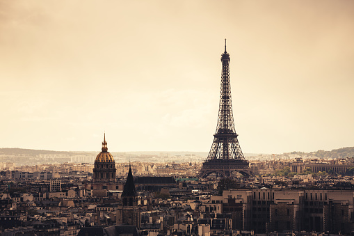 Paris cityscape with Eiffel Tower at sunset (Paris, France).