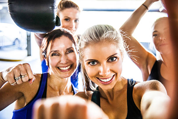 istock Fitness friends having a break with selfie post workout 595128206