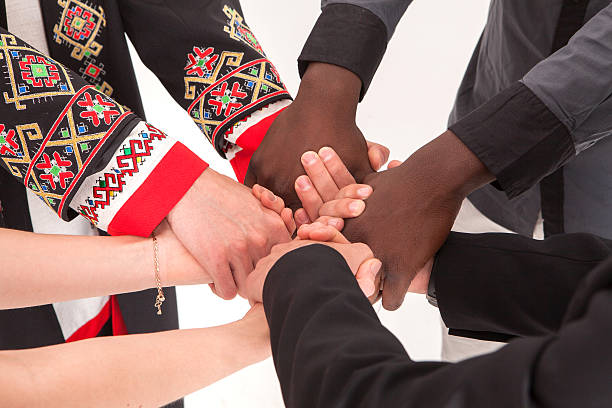 People of different nationalities. friendship, communication, teamwork, education, recruitment. People of different nationalities. Volunteers. The concept of friendship, communication, teamwork, education, recruitment. different religion stock pictures, royalty-free photos & images