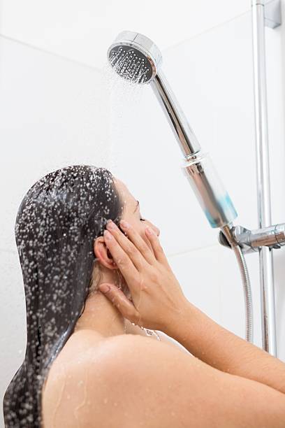 istock Woman washing hair 595140296