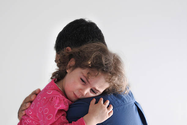 istock Father comforting his  daugther 595140698