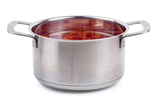 istock Hot borsch in a steel pan isolated 595141850