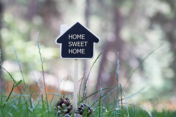 istock House shaped chalkboard on nature background 595143464