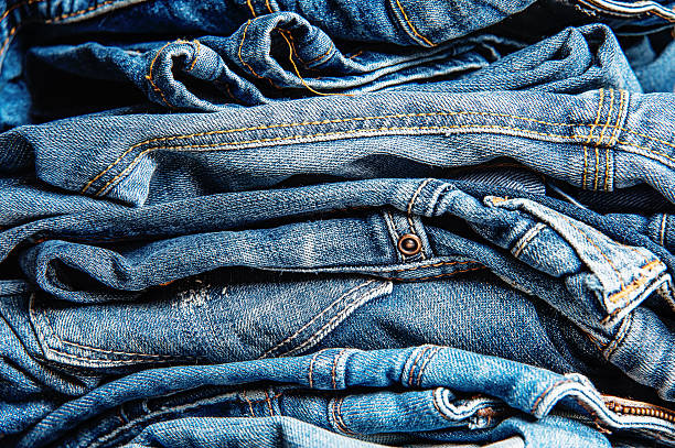 istock Stack of jeans, Background fashion . 595147888