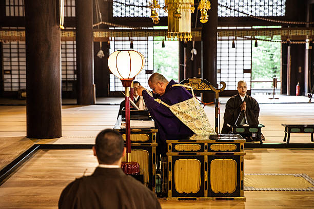 istock Buddhist monks praying in early morning inside a Temple 595147946