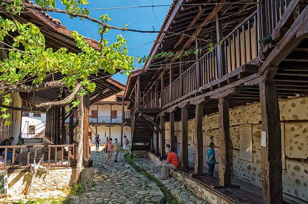 Rozhen Monastery, Bulgaria Rozhen, Bulgaria - August 16, 2016: People walking or sitting in the courtyard of Rozhen Monastery Nativity of the Mother of God, a medieval Bulgarian monastery in Pirin Mountains in southwestern Bulgaria near Melnik. blagoevgrad province photos stock pictures, royalty-free photos & images