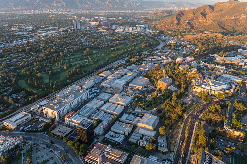 Los Angeles, California, USA - July 21, 2016:  Late afternoon aerial of Universal City Studios, Burbank and Griffith Park.  