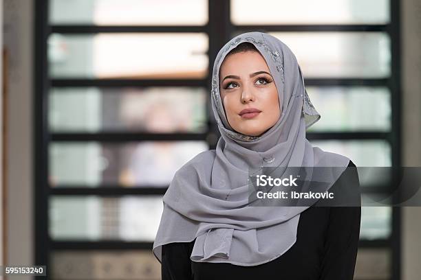 Young Caucasian Woman Praying With Head Dress Stock Photo - Download Image Now - Salah - Islamic Prayer, Women, Adult