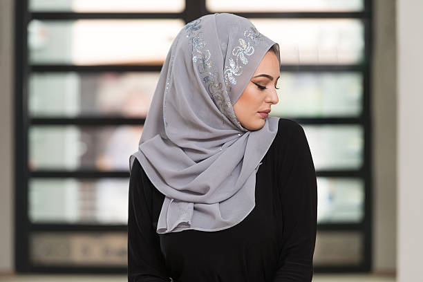 istock Woman Praying In The Mosque 595153480