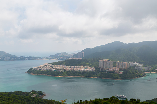 The view from the famous Dragon's Back Trail in Hong Kong, China.  You can see part of the city in the distance across the water.  This trail is one of the most famous hikes in China and is located in the mountains just outside the city.