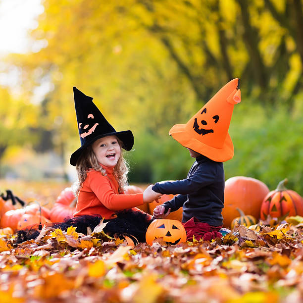 istock Kids with pumpkins on Halloween 595155076