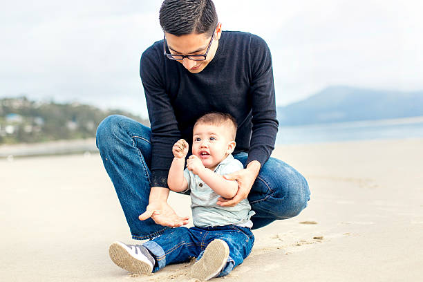 istock Young ethnic father playing with his son 595155344