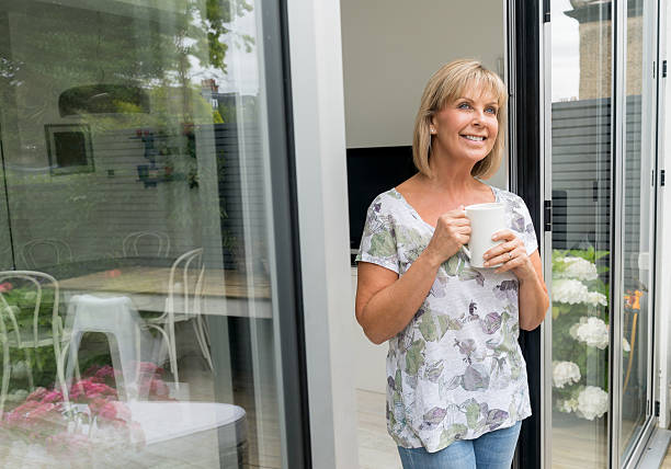 istock Thoughtful senior woman drinking coffee 595155592