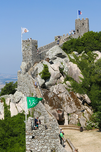 Sintra, Portugal - July 19, 2016: Unidentified people at the Castle of the Moors (Castelo dos Mouros), a hilltop medieval castle located in Sintra, Lisbon district, Portugal.
