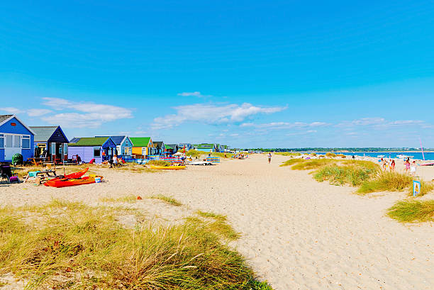 Hengistbury head beach Christchurch, United Kingdom - August 15, 2016: This is Hengistbury head main beach where people come for vacations, surfing and sailing on August 22, 2016 in Christchurch christchurch england photos stock pictures, royalty-free photos & images