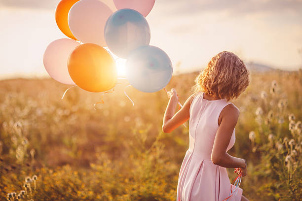 istock Girl walking in wheat field 595157804