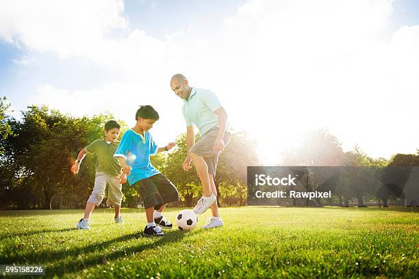 Soccer Fun Sports Family Playing Concept Stock Photo - Download Image Now - Soccer, Family, Playing