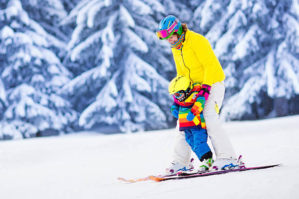 istock Mother and little boy learning to ski 595159188