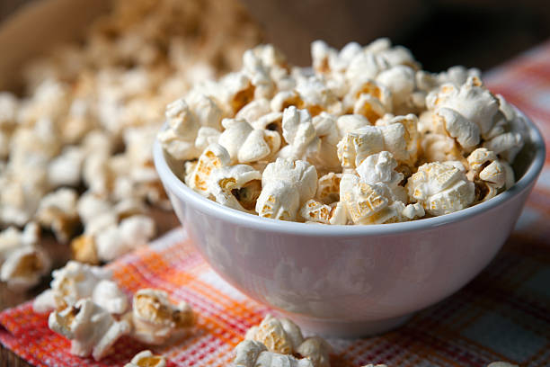 istock popcorn into a bowl on a napkin in the kitchen 595159506