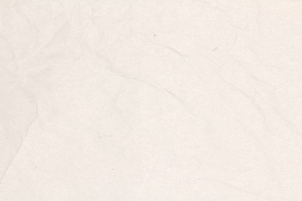 istock Recycled crumpled light brown paper texture or paper background. 595159624
