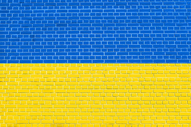 istock Flag of Ukraine on brick wall texture background 595159982