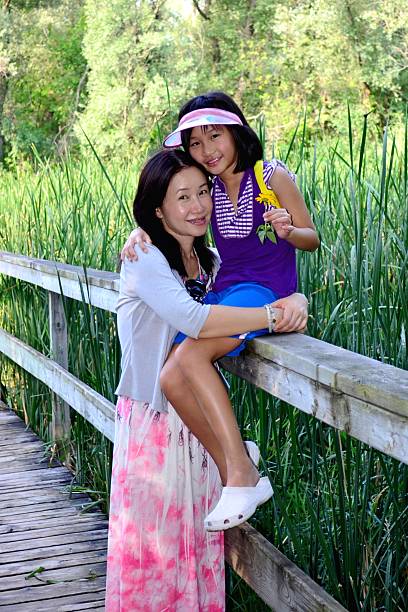 istock Mother and daughter hug 595160514
