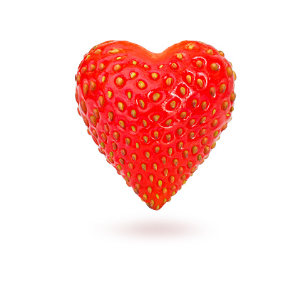 Strawberries in heart shape on white background