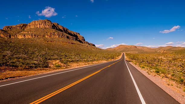 istock Long and empty lonesome road through Arizona 595161728