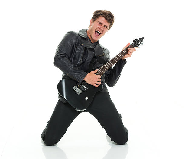 ocasionales hombre tocando la guitarra excitación - isolated on white studio shot guitar young men fotografías e imágenes de stock
