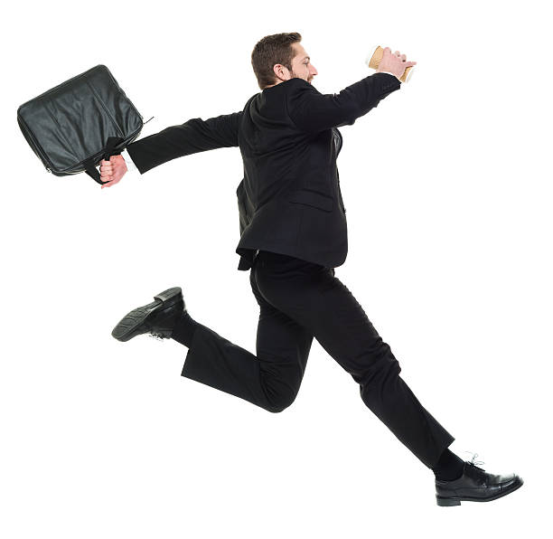 istock Smiling businessman jumping 595317212