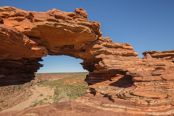 istock Layered Rockformation Presenting a Natural Window at Kalbarri National Park 595321112