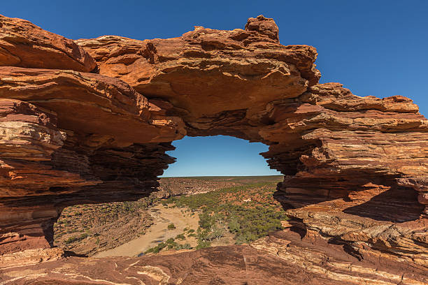 istock Layered Rockformation Presenting a Natural Window at Kalbarri National Park 595321408