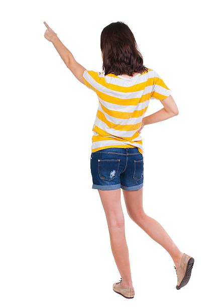 istock Back view of  pointing woman. 595321804