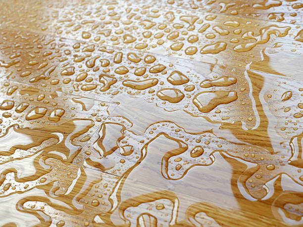 istock Parquet. Water drops on wooden surface. 595321998