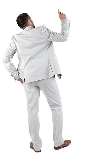 istock Back view of  thinking young business man in  white suit. 595323122