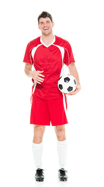 istock Cheerful soccer player holding ball 595324196