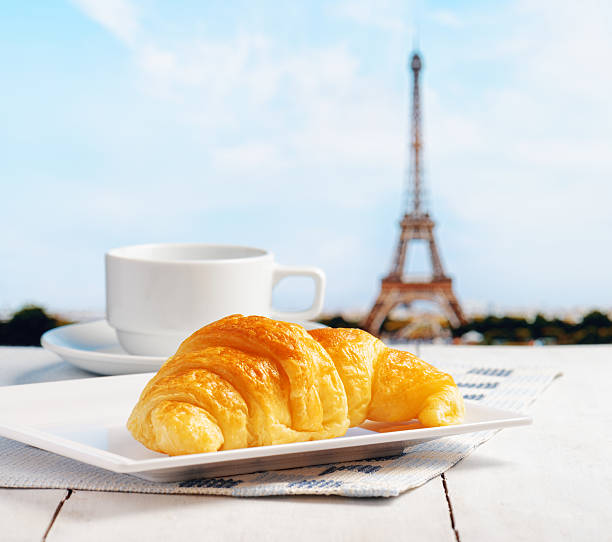 Cup of coffee and croissant in Paris. French cafe.