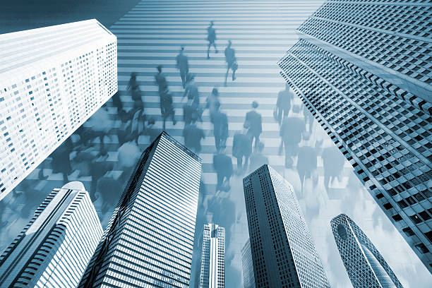 istock Digital Composite Image of Office Buildings and City Commuters 595325994