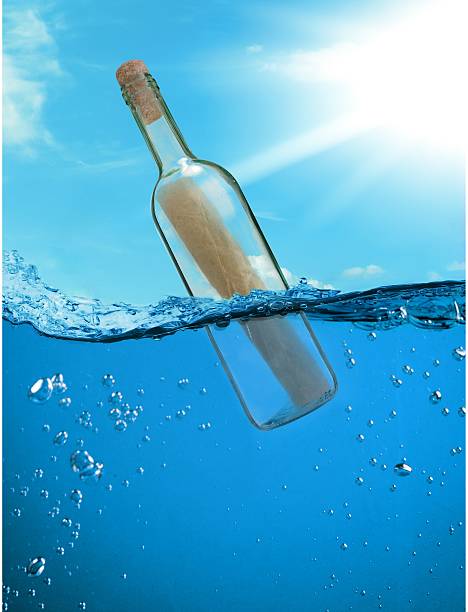 istock Bottle with a letter from the wreck 595326258