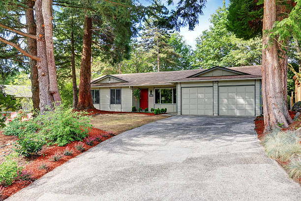 istock American rambler exterior with double doors garage. 595328554