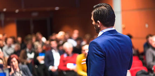 istock Public speaker giving talk at Business Event. 595328652
