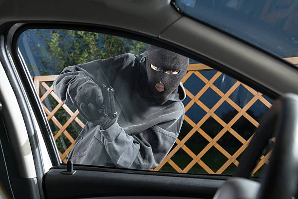 Villain with a gun threatened driver stock photo