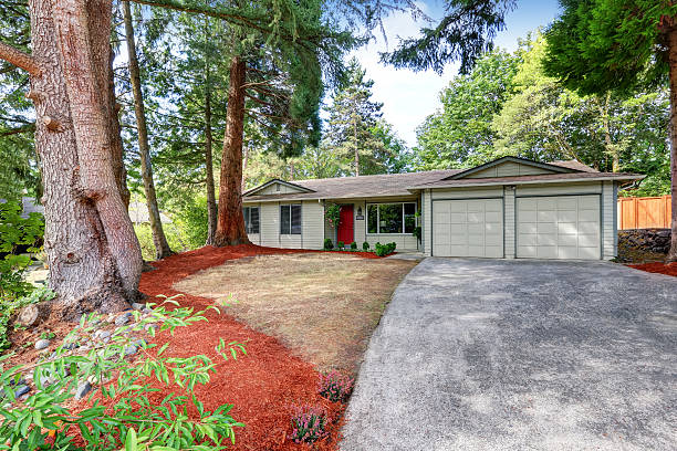 istock American rambler exterior with double doors garage. 595328714