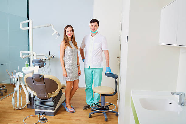 Dentist and patient   office. Dental treatment Dentist and patient in the dental office. Dental treatment in the dental clinic. ambulant patient stock pictures, royalty-free photos & images