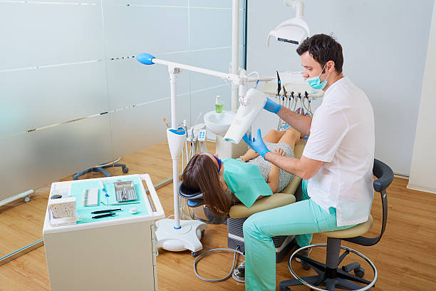 istock Teeth whitening in the dentist's office with professional equipm 595330202