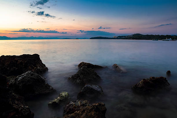 istock Boulders on Beach at Sunrise, Corfu, Greece 595331146