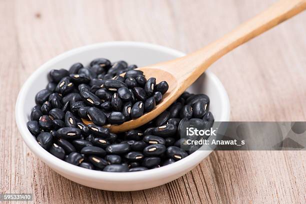 Black Beans In Wooden Spoon With Seramic Bowl Stock Photo - Download Image Now - Black Bean, Bean, Brown