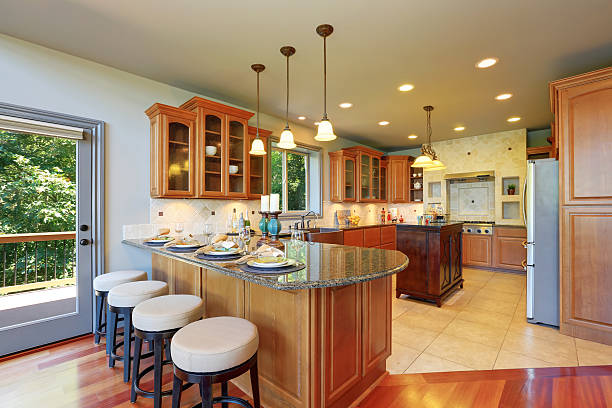 istock Luxury kitchen room interior with cabinets and granite counter tops 595335598