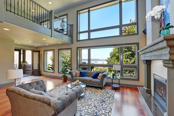 istock Grey interior of high vaulted ceiling family room. 595335710
